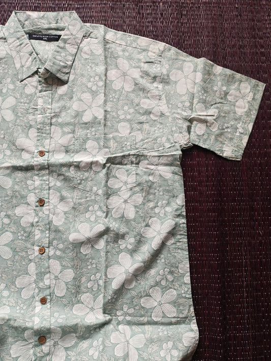 Floral patterned shirt on a dark textured surface